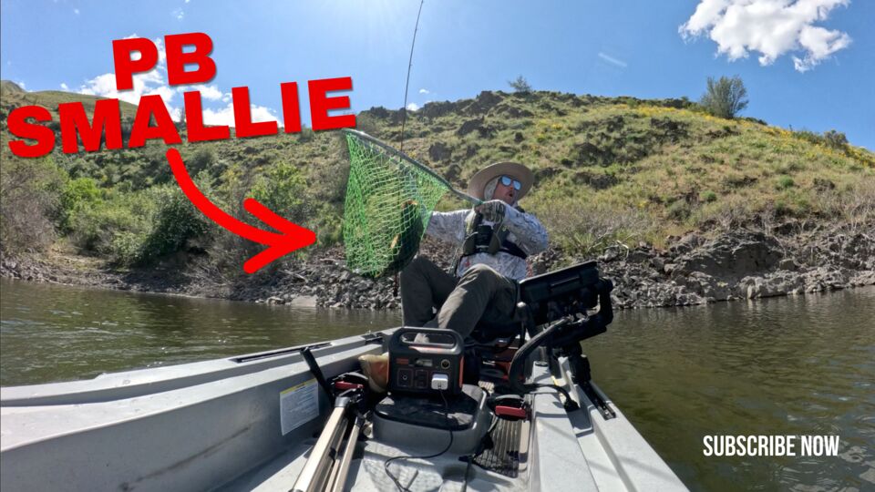Thumbnail: netting a personal best smallmouth from the kayak